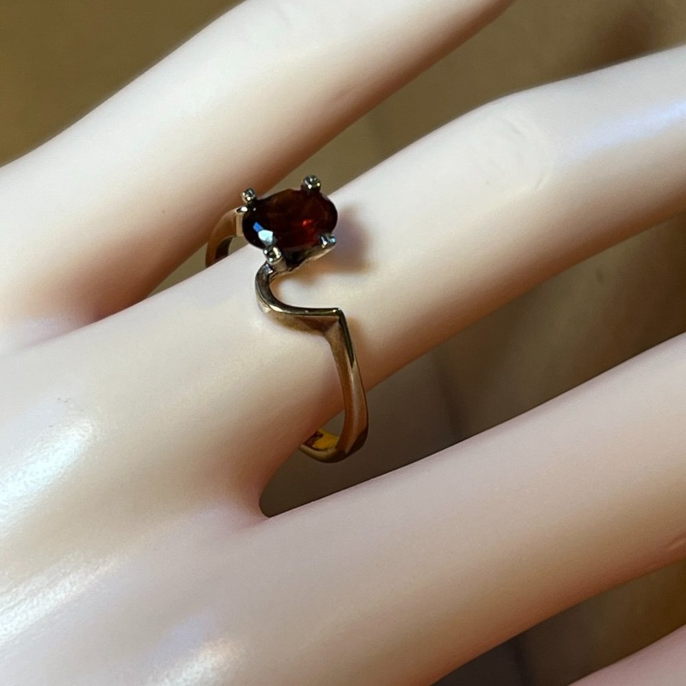 Genuine red zircon ring  size 7.5   Stamped 14k T HGE  plated